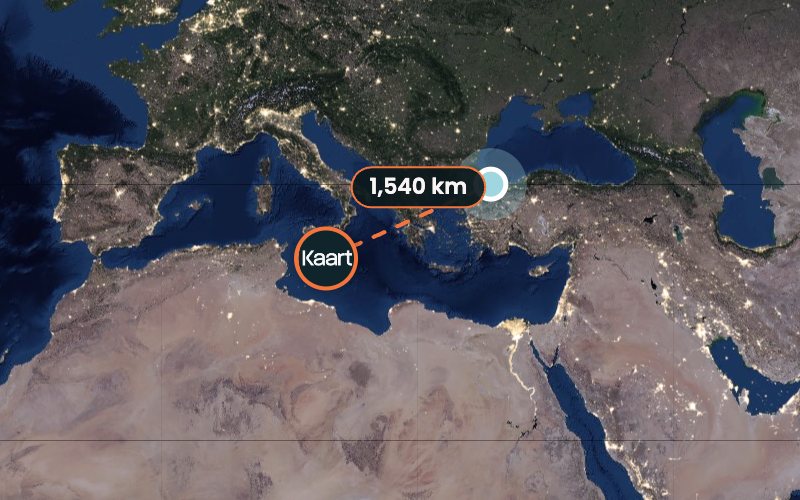 Pin Drop: a Kaart badge pin 1,540 km from the target city on a night-lights map